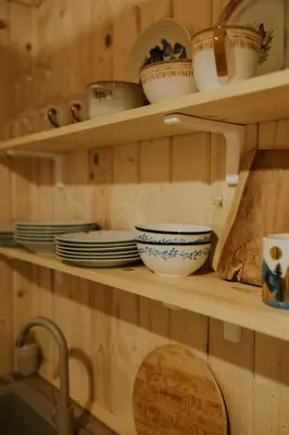 a cabin in the woods with a lot of wood at Domki pod Halą Krupową - Tiny House w Lesie in Sidzina