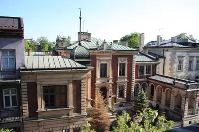 a group of old brick buildings in a city at Just4You Apartments in Kraków