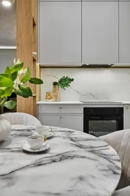 a kitchen with a marble table with a bowl on it at Apartament Krasińskiego- w centrum Krakowa, doskonała lokalizacja in Kraków
