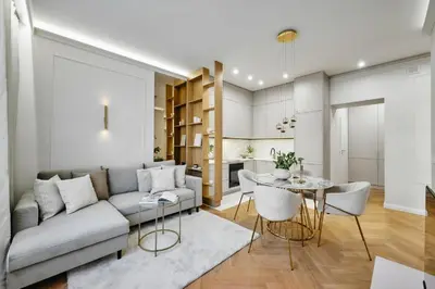 a living room with a couch and a table at Apartament Krasińskiego- w centrum Krakowa, doskonała lokalizacja in Kraków