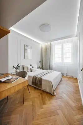 a white bedroom with a bed and a desk at Apartament Krasińskiego- w centrum Krakowa, doskonała lokalizacja in Kraków