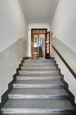a staircase leading up to a door in a building at Apartament Krasińskiego- w centrum Krakowa, doskonała lokalizacja in Kraków