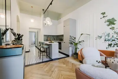 a living room with a kitchen and a living room with a couch at Modern DeLux Apartment! - air conditioning in Kraków