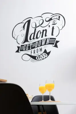 two glasses of wine on a table with a sign at Dietla Studio with a mezzanine in the center of Kraków by Noclegi Renters in Kraków
