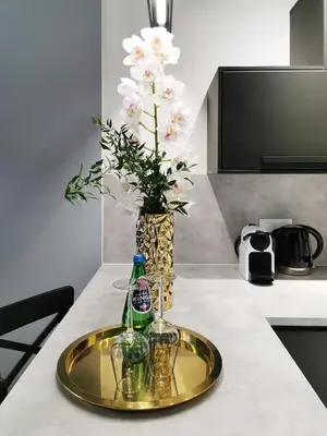 a bedroom with a bed and a living room at Bed&Bath Modern Old Town Apartments in Kraków