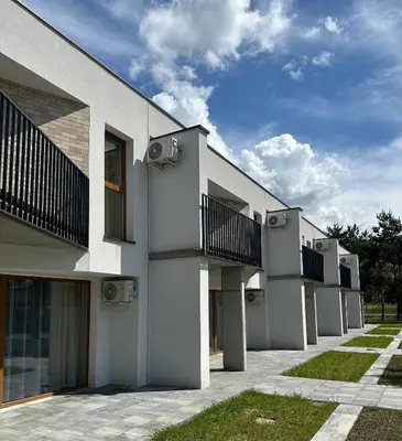 a building with balconies on the side of it at SOLAPART Apartamenty in Oświęcim