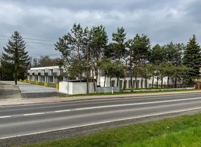 an empty street with a building on the side of a road at SOLAPART Apartamenty in Oświęcim