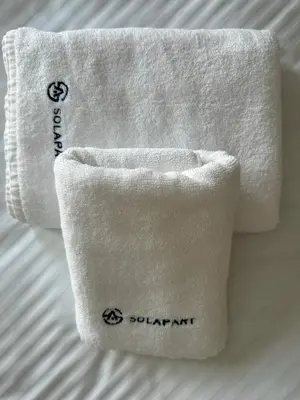 a white towel with the words quarantine on it at SOLAPART Apartamenty in Oświęcim