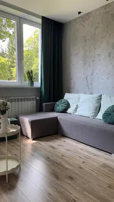 a large bed in a room with a window at Rivershine Apartment Cracow in Kraków