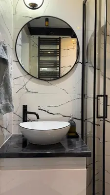 a bathroom with a white sink and a mirror at Rivershine Apartment Cracow in Kraków