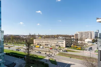 a view of a city with buildings and a street at Grzegórzki Comfy Apartment by BookingHost in Kraków