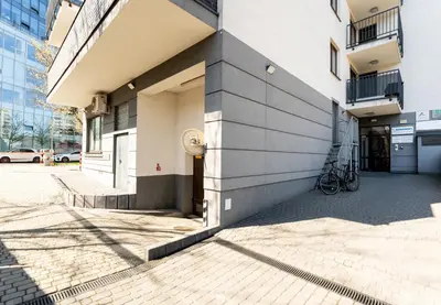 a building with a fire hydrant on the side of it at Grzegórzki Comfy Apartment by BookingHost in Kraków
