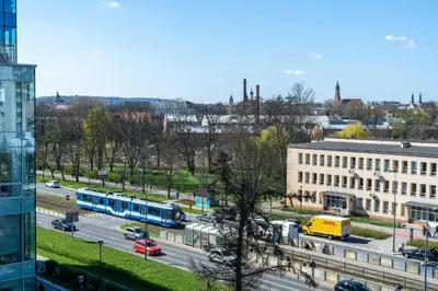 a view of a city with buses on a street at Grzegórzki Comfy Apartment by BookingHost in Kraków