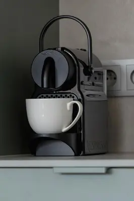 a tea kettle with a cup on a kitchen counter at Nowoczesny Rodzinny Apartament z Klimatyzacją i Parkingiem w Krakowie by Renters Prestige in Kraków