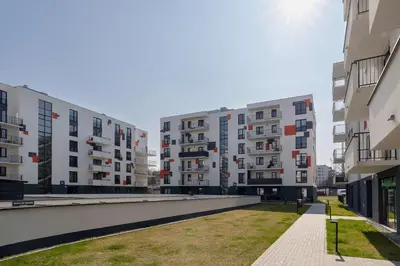 a row of apartment buildings in a city at Nowoczesny Rodzinny Apartament z Klimatyzacją i Parkingiem w Krakowie by Renters Prestige in Kraków