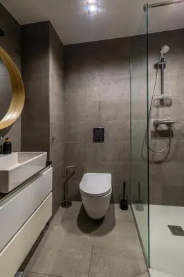 a bathroom with a toilet and a sink and a shower at Loft Place Oswiecim - Air Conditioning, City Center, Self Check-in in Oświęcim