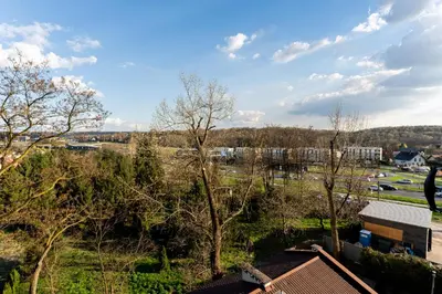 a view of a field with trees and buildings at Podłęska Comfort Apartment by BookingHost in Kraków