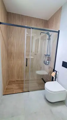 a bathroom with a shower and a toilet at Apartament 3A na ul Wiejskiej 32c in Oświęcim