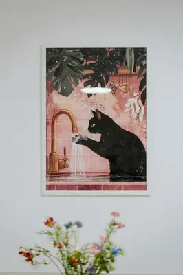 a picture of a black cat playing in a sink at Apartament 3A na ul Wiejskiej 32c in Oświęcim