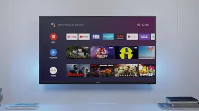 a flat screen tv hanging on a wall at Parkside Family Suite in Kraków