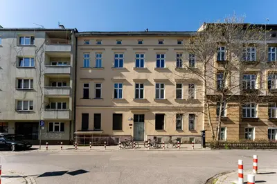 a large building with bikes parked in front of it at Malila Premium Apartments Cracow Świętego Łazarza 3 in Kraków