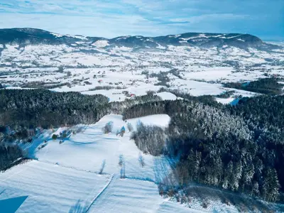 an aerial view of a ski slope in the snow at Raj na Hektarach in Wysokie