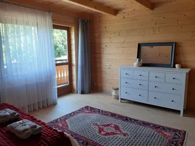 a living room with a dresser and a mirror at Villa of Roses in Lanckorona