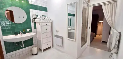 a bathroom with a sink and a green wall at IMPERIaL 110 m2, 4 rooms, Old Town, 300m Wawel, Breakfest in Kraków