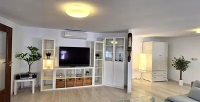 a living room with a flat screen tv on a wall at IMPERIaL 110 m2, 4 rooms, Old Town, 300m Wawel, Breakfest in Kraków