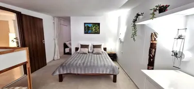 a bedroom with a bed in a white room at IMPERIaL 110 m2, 4 rooms, Old Town, 300m Wawel, Breakfest in Kraków