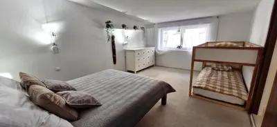 a bedroom with a bed and a dresser and a window at IMPERIaL 110 m2, 4 rooms, Old Town, 300m Wawel, Breakfest in Kraków
