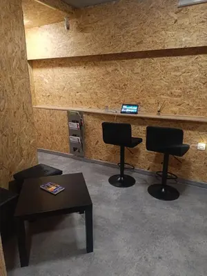 a waiting room with two chairs and a table at Kapsuła #2 Centrum in Kraków