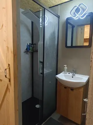 a bathroom with a shower and a sink at Kapsuła #2 Centrum in Kraków