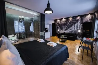 a room with a bed with two towels on it at Jacuzzi & Relax by Leo Apartments Old Town in Kraków