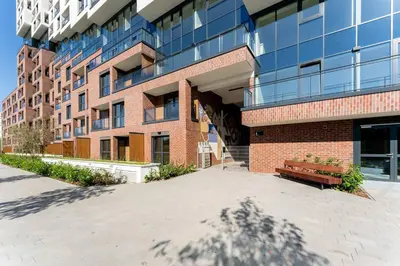 a brick building with a bench in front of it at HolidayHome Kraków Center in Kraków