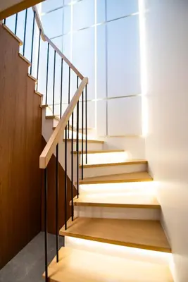 a staircase in a house with a glass wall at Luxury penthouse with large terrace in Kraków