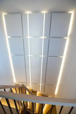 a room with a ceiling with lights on it at Luxury penthouse with large terrace in Kraków