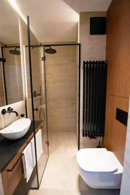 a bathroom with a toilet and a sink and a shower at Luxury penthouse with large terrace in Kraków