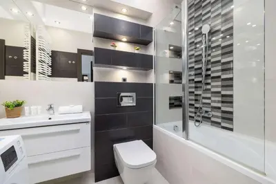 a bathroom with a toilet and a sink and a shower at Modern Apartment with Air Conditioning and Parking in Cracow by Noclegi Renters in Kraków