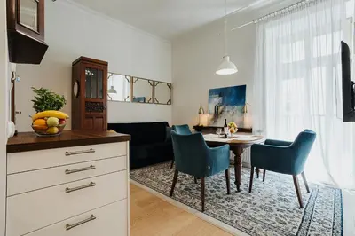 a kitchen and dining room with a table and chairs at TOP Cracow Main Hub in Kraków