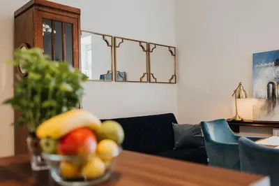 a bowl of fruit on a table in a living room at TOP Cracow Main Hub in Kraków
