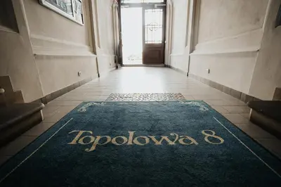 a hallway with a rug with the word tokyo on it at TOP Cracow Main Hub in Kraków