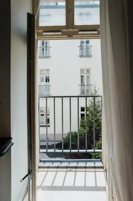 an open window with a view of a building at TOP Cracow Main Hub in Kraków