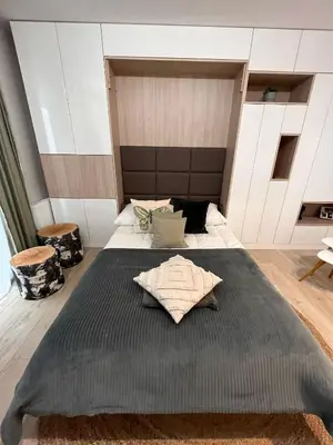a bedroom with a large bed in a room at Cubicle 22 Garden & Free Parking in Kraków