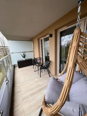 a porch with a hanging hammock on a house at Cubicle 52 Terrace & Free Parking in Kraków