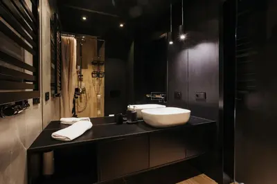 a bathroom with a white sink and a shower at Cubicle 72 Studio Big Terrace in Kraków