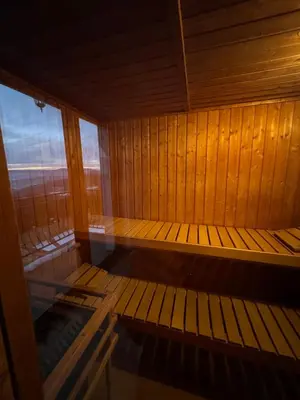 an empty sauna with a view of the ocean at Widokówka Kudłacze Domek z Jacuzzi in Pcim