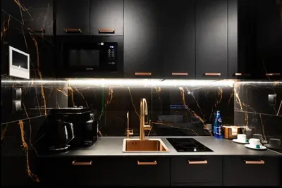 a kitchen with a sink and a microwave at Jacuzzi Glass-House Wislane Tarasy with Sauna and Parking in Kraków