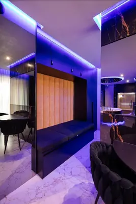 a living room with a couch and a table at Jacuzzi Glass-House Wislane Tarasy with Sauna and Parking in Kraków