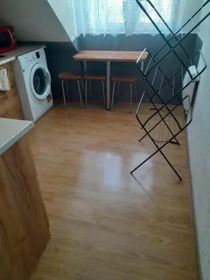 a kitchen with a sink and a washing machine at apartament przytulny in Ogrodzieniec
